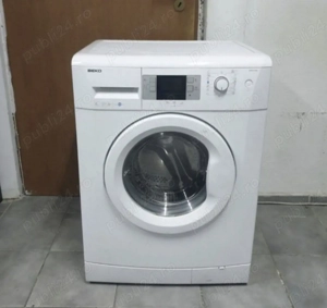 Mașină de spălat rufe automată Beko. 