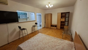 Titan proprietar garsoniera