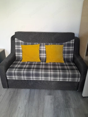 Canapea extensibilă.