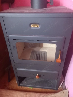 vînd sobă pe lemne. 