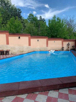 Casa P+1+M cu piscina si 1057 mp de teren, pozitionata inedit - imagine 4