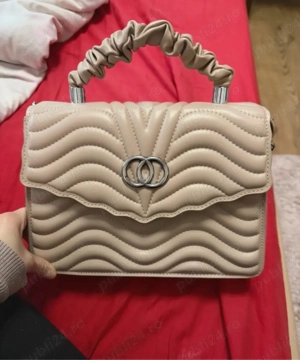 geanta cu maner incretit