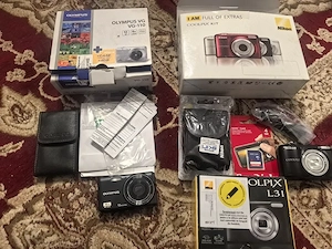 Aparate foto Nikon și Olympus noi și neutilizate