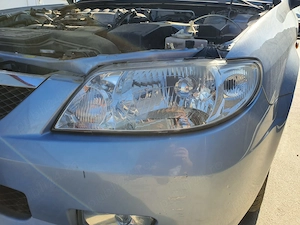 Far stanga Mazda 323