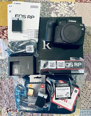 Canon RP, in garantie, + Bonus: acumulator, card si geanta foto