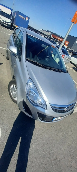 Opel Corsa 2011, 67.000 km reali, unic proprietar, AC   3.900 Euro  - imagine 4