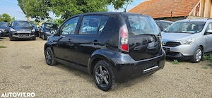 Daihatsu Sirion 4x4  an 2009 motor 1300 cm3 benzina clima  - imagine 2