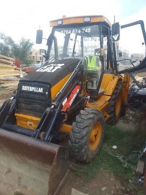 Buldoexcavator Caterpillar 