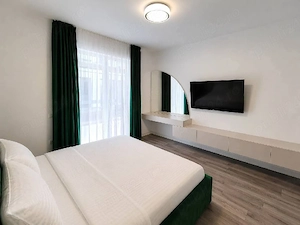 Inchiriez apartament ultramodern cu 3 camere decomandat + terasă si grădină - imagine 11