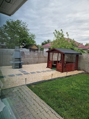 Casă modernă cu design aparte și grădină amenajată   de închiriat în Tunari - imagine 4