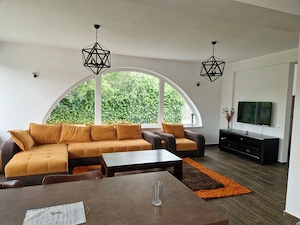 Casă modernă cu design aparte și grădină amenajată   de închiriat în Tunari - imagine 3