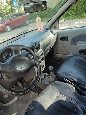 vând Dacia Logan motor de 1 4 benzina acte valabile mașina merge impecabil fara probleme  - imagine 4