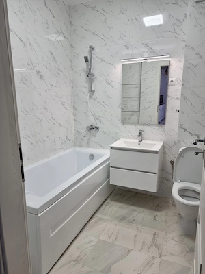 Ofer spre inchiriere apartament doua camere, bloc nou, cartier rezidential. Loc de parcare privat - imagine 7