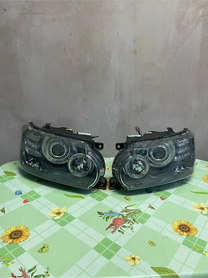 Faruri originale Range Rover Sport L320 facelift bi-xenon OEM