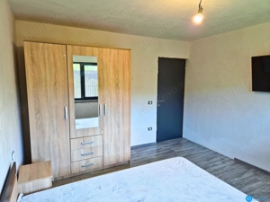 CASA PE PARTER IN BUJORENI - LINISTE, CURTE SI VEDERE SPRE VF. COZIA - imagine 12
