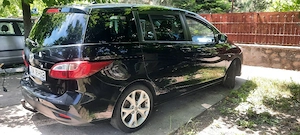 Vand mașina noastră  de familie Mazda 5 ,7 locuri ,cui remorca ,6 viteze pilot automat,etc  