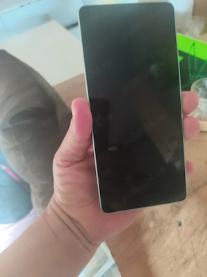 vind un Redmi 13 este bun nu este apart merge bine 