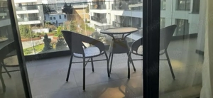 Apartament de închiriat 2 camere Nusco City Pipera | Vedere către grădina - imagine 10