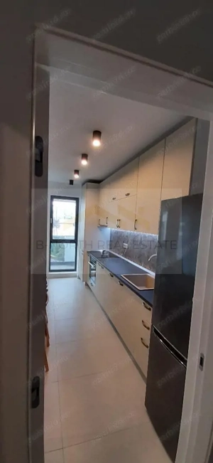 Apartament de închiriat 2 camere Nusco City Pipera | Vedere către grădina - imagine 4