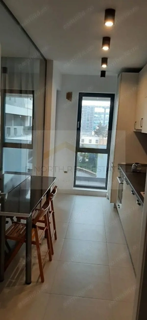 Apartament de închiriat 2 camere Nusco City Pipera | Vedere către grădina - imagine 6