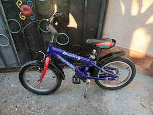 Bicicleta pentru copii de 4-8 ani , cu roti de 16 inci bine centrate , in perfecta stare de function