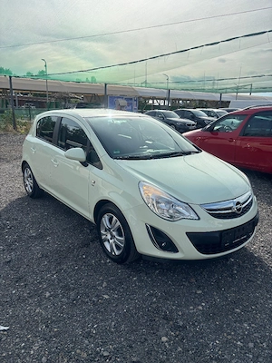 Opel Corsa-2011 - imagine 2