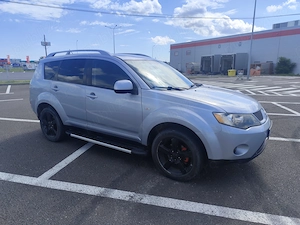 Mitsubishi Outlander II 2.0 DID 140 CP 4x4 7 LOCURI - imagine 7