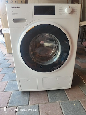 Mașina de spălat haine marca Miele