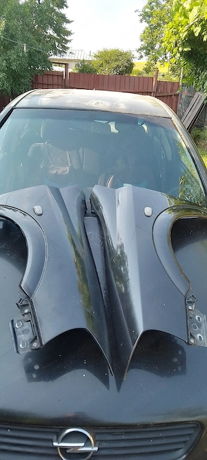 Set aripi față Opel Astra G Hatchbak 5 uși. Culoare Negru Z 298XXCL67 .