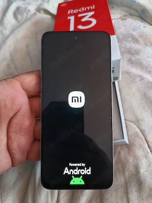vând tel marca Redmi 13 