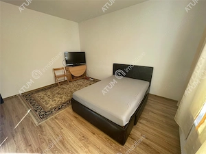 Apartament la casa cu 2 camere decomandate curte comuna central Sibiu