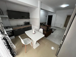 Închiriez apartament nou,modern cu 2 camere complet mobilat și utilat  - imagine 2