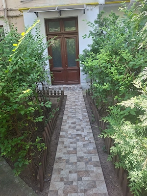 Piata Rosetti 2 camere parter in vila ideal birou parcare in curte         curte 