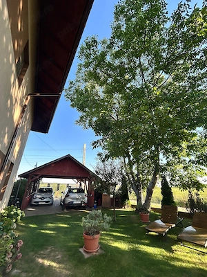 Casa 4 camere si teren de 1000 mp, garsoniera separata, foisor,carport - imagine 8