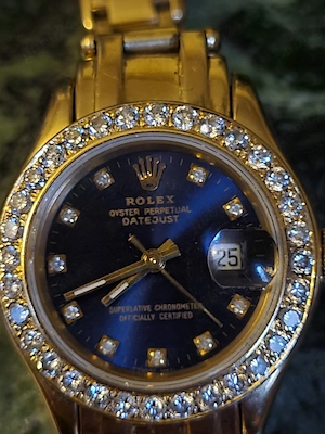 Rolex aur 18 kt cu diamante.