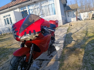 motor de 49cc merge foarte bine nu am probleme cu el pornește repede ,funcționează pe benzina  - imagine 1