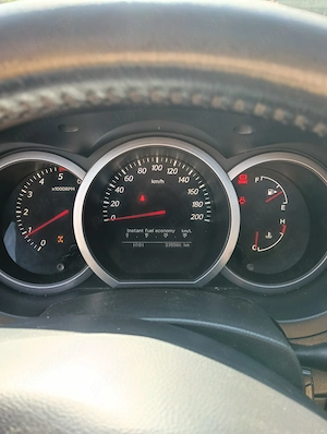 Suzuki Grand Vitara 1,9DDIS 4x4 din 2012 - imagine 4