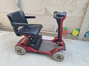 Carut- scuter electric pers  dizabilități 