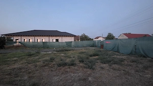 Vand teren si casa intabulata  cu panouri solare  Dinias 