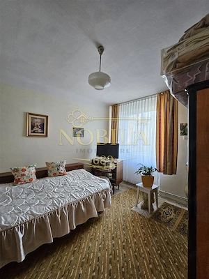 Apartament cu GRADINA SI ACOPERIS  MANSARDA DE VANZARE IN ONESTI ETJ 1 - imagine 6