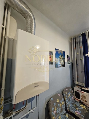 Apartament cu GRADINA SI ACOPERIS  MANSARDA DE VANZARE IN ONESTI ETJ 1 - imagine 17
