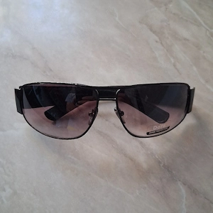 Ochelarii de soare vintage  Dora Italy Design  cu rame imbracate in piele.
