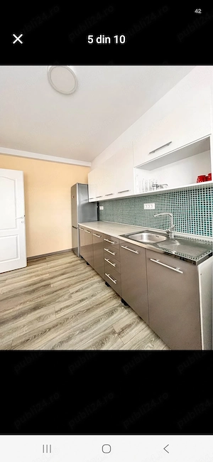 Ofer spre închiriere un apartament luminos și spațios, cu o suprafață de 50 mp, situat pe strada Tău - imagine 5