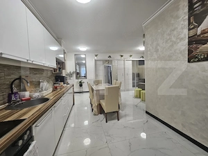 Apartament decomandat cu 3 camere, gradina proprie, parcare, in centrul Floresti - imagine 2