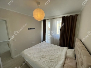 Apartament 2 camere decomandate balcon loc parcare zona Brana Selimbar - imagine 5