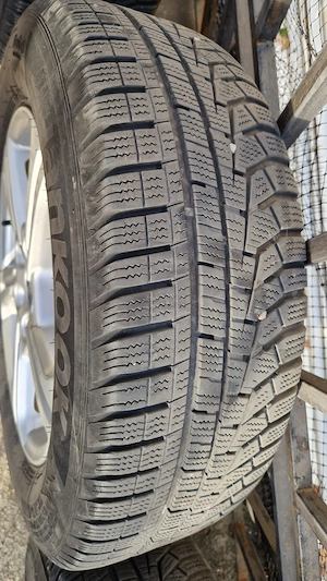 Set 4 Jante originale aliaj Ford Puma+cauciuc iarna Hankook 205/65 R16 - imagine 6