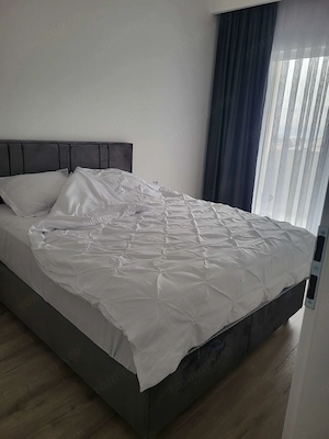 Închiriez apartament cu parcare subteranâ