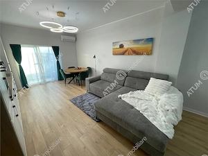 Apartament nou 2 camere balcon loc parcare zona Brana Selimbar - imagine 1